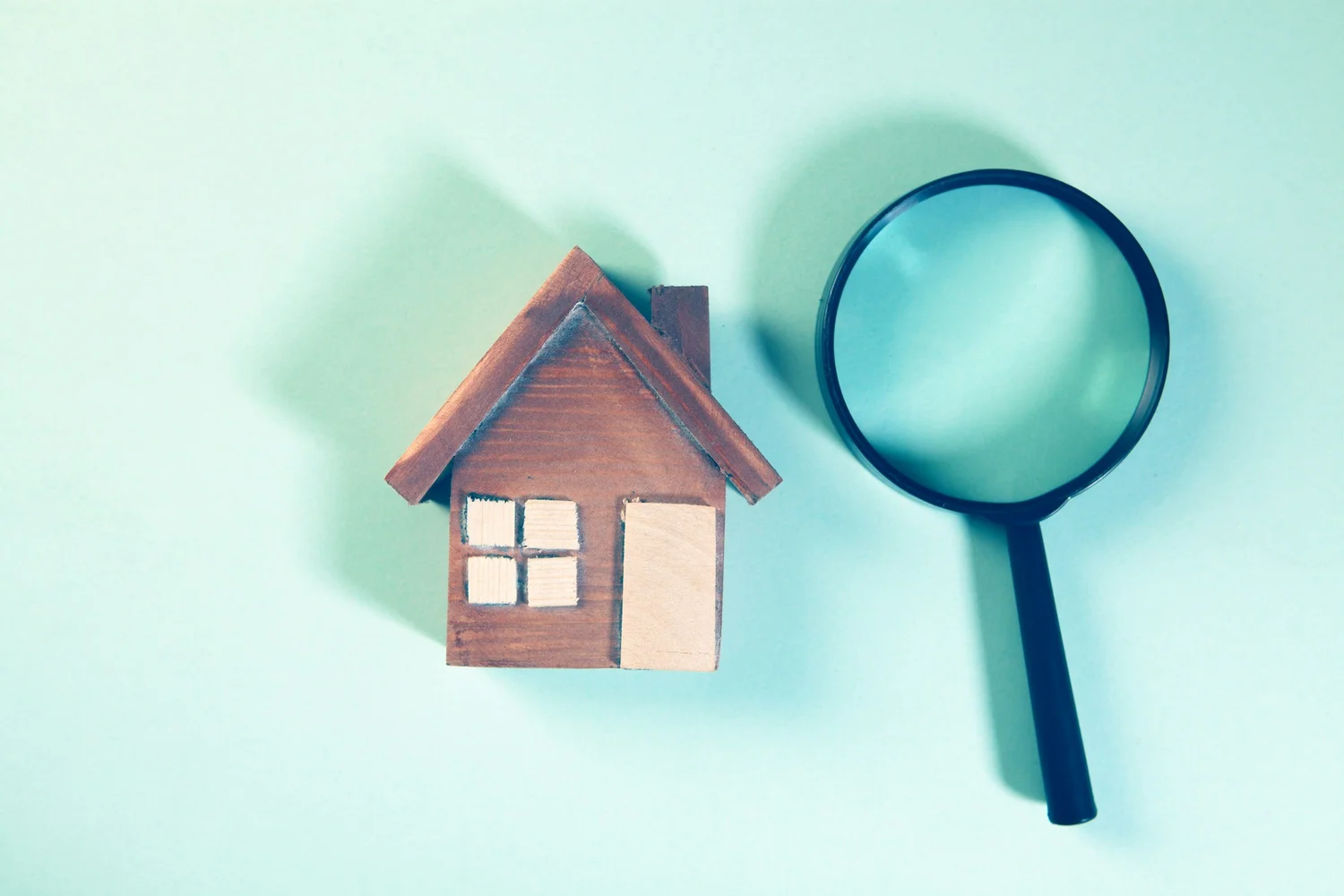 Reviewing property inspection details on a laptop